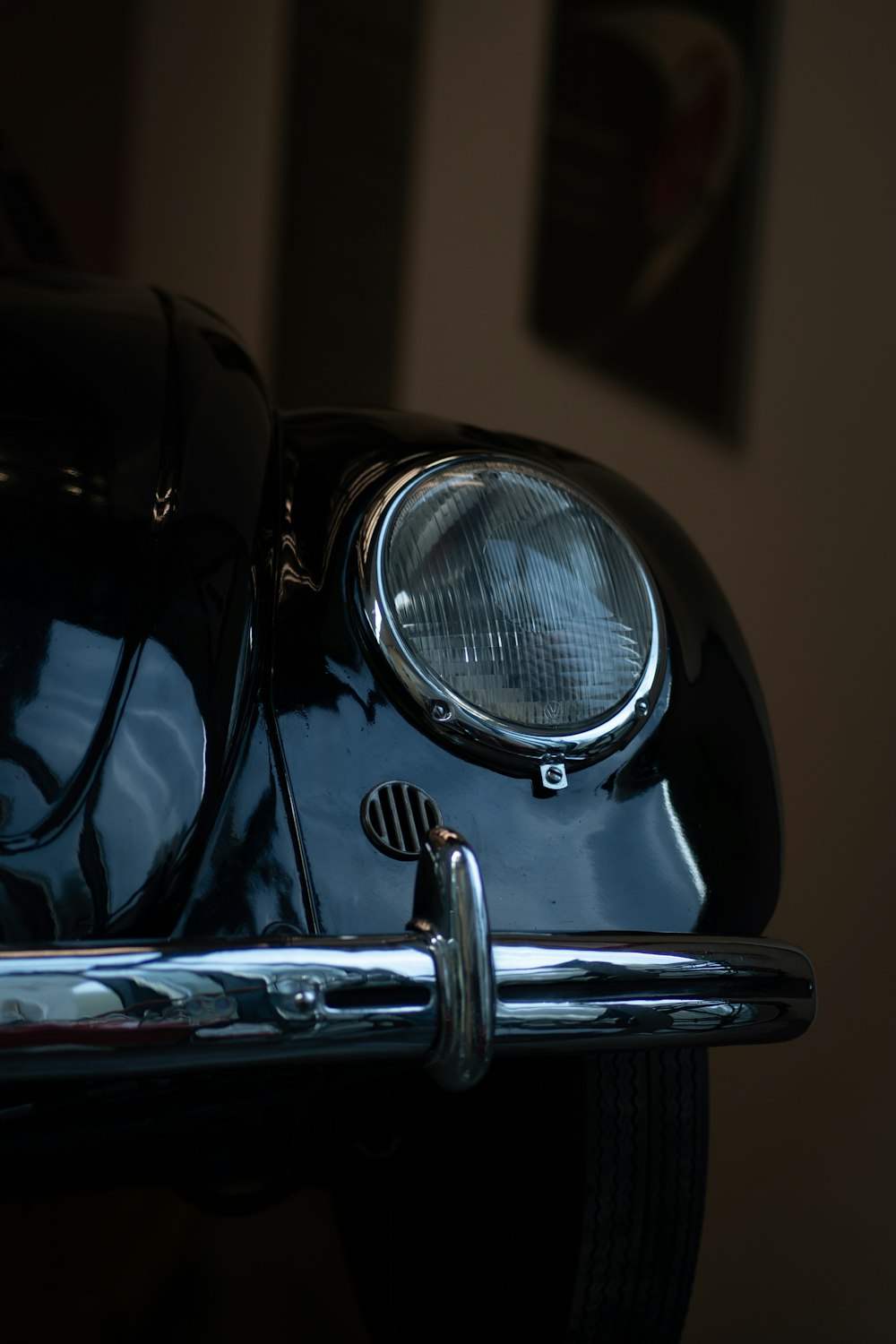 a close up of the front end of a classic car