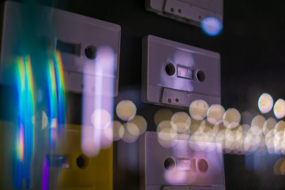 a close up of a group of cassettes on a wall