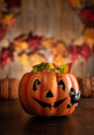 a carved pumpkin sitting on top of a wooden table