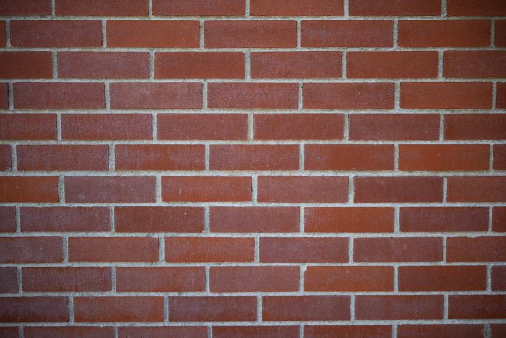 a close up of a red brick wall