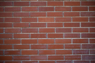 a close up of a red brick wall