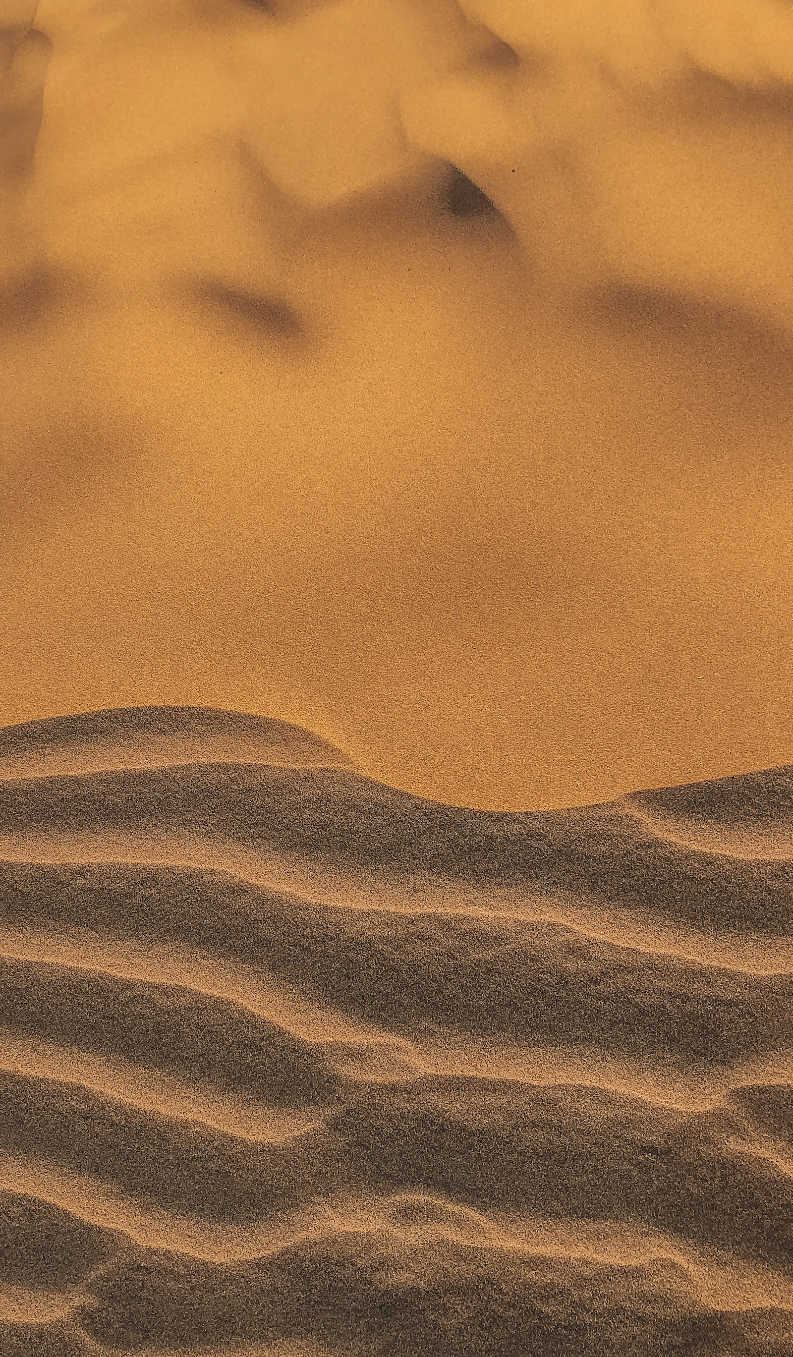 Sun-baked desert dunes, the environment a Kuwait home's air conditioning fights all summer