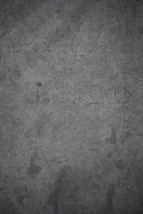 a black and white photo of a concrete wall