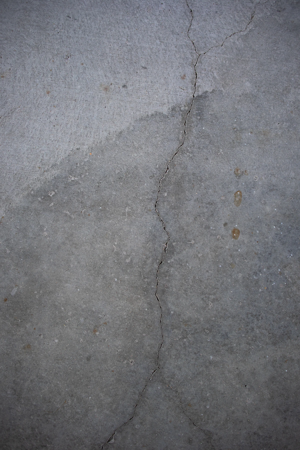 Worn plain concrete before a decorative finish