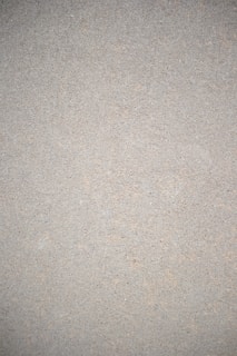 A close-up of a smooth microcement surface on a kitchen countertop.