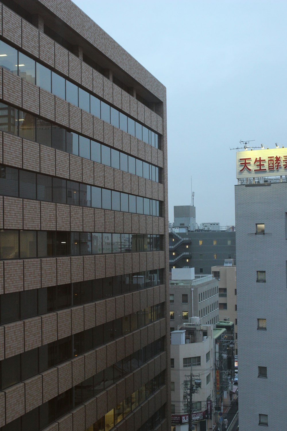 a tall building with a sign on top of it