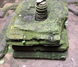 A quiet moment showing natural stone markers surrounded by green moss.