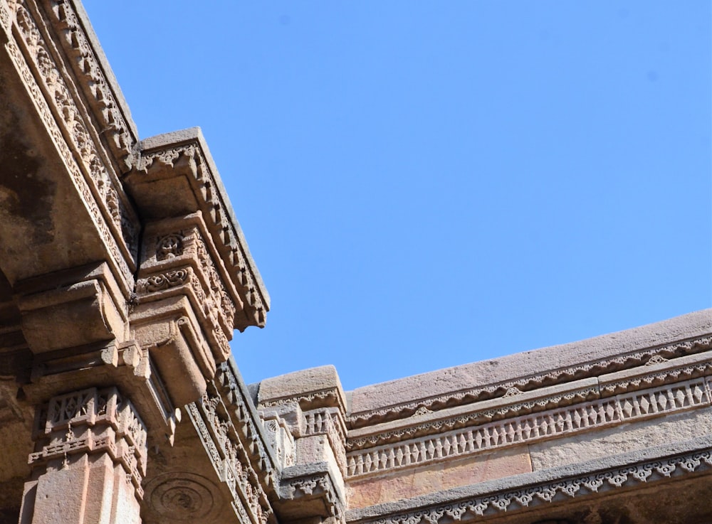 a close up of a building with a blue sky in the background