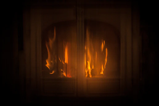 A warm, inviting hearth glowing softly in a peaceful room symbolizing hope and dignity.