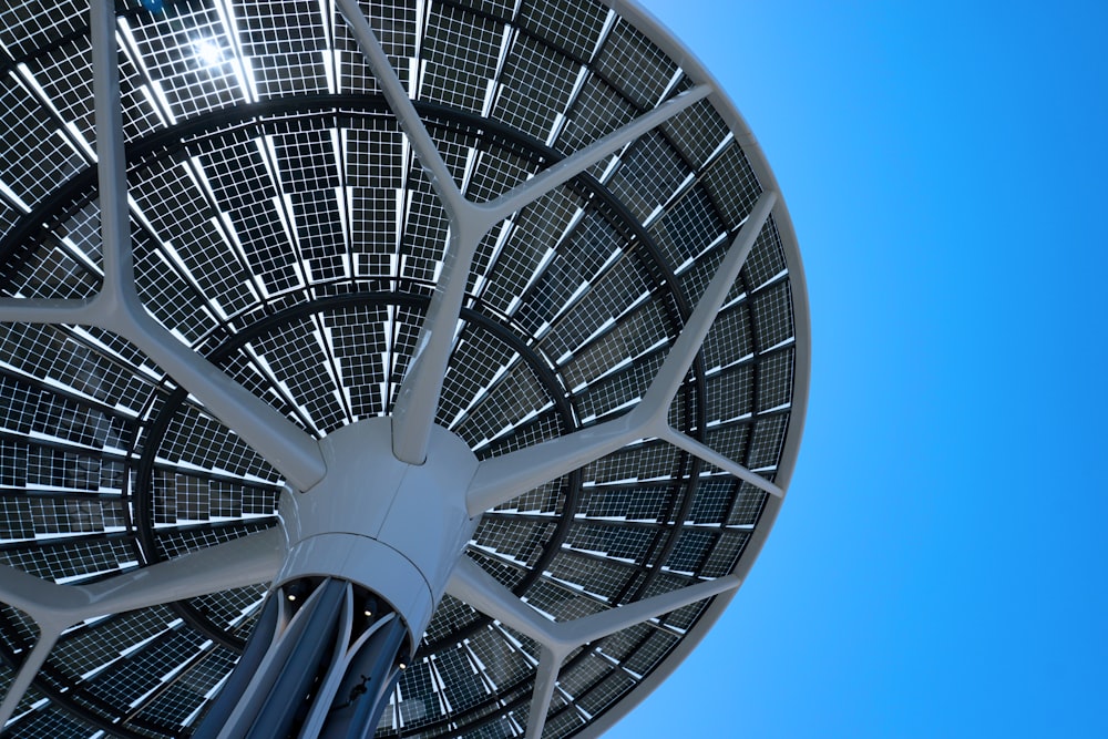 a close up of a metal structure with a blue sky in the background