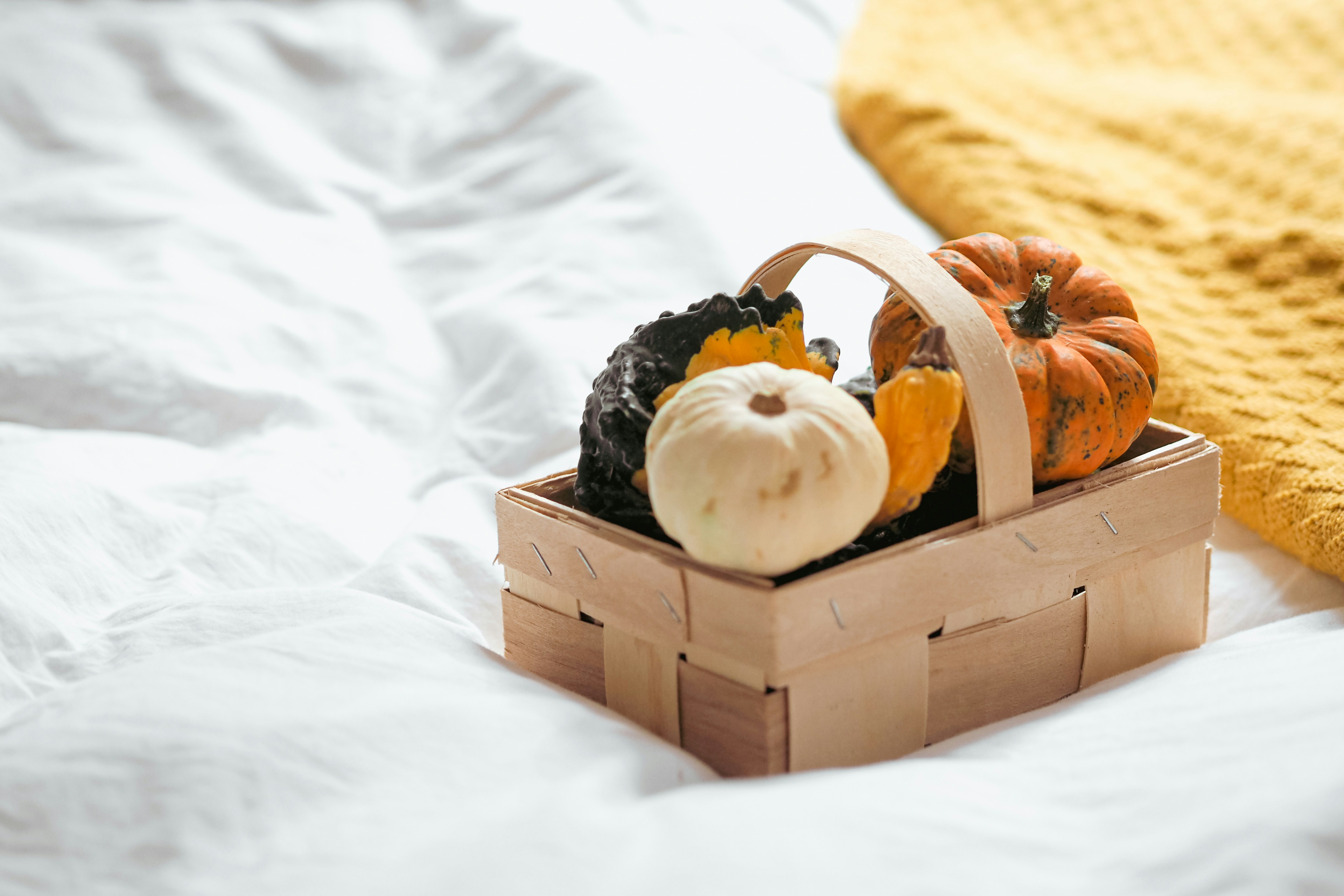 cozy autumn harvest gift basket with warm tones and seasonal treats
