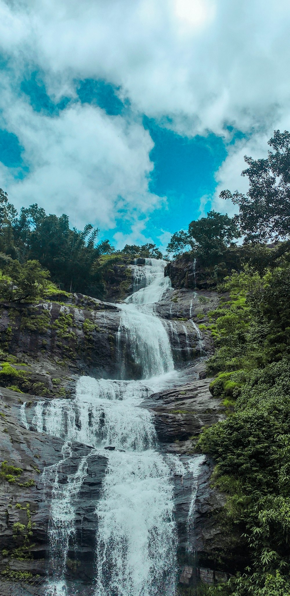 a large waterfall with lots of water coming out of it