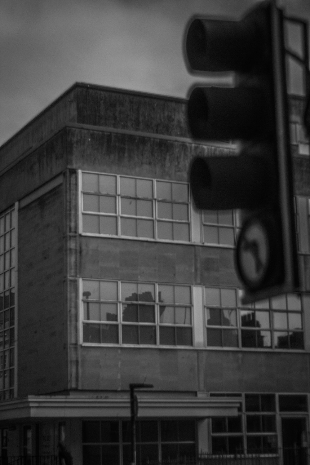 a black and white photo of a traffic light