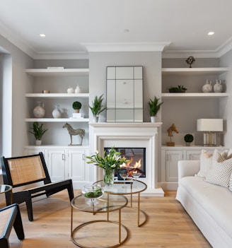 a living room filled with furniture and a fire place