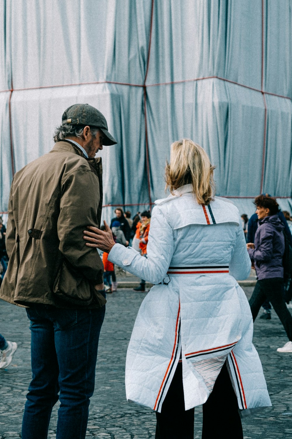 a man and a woman standing next to each other