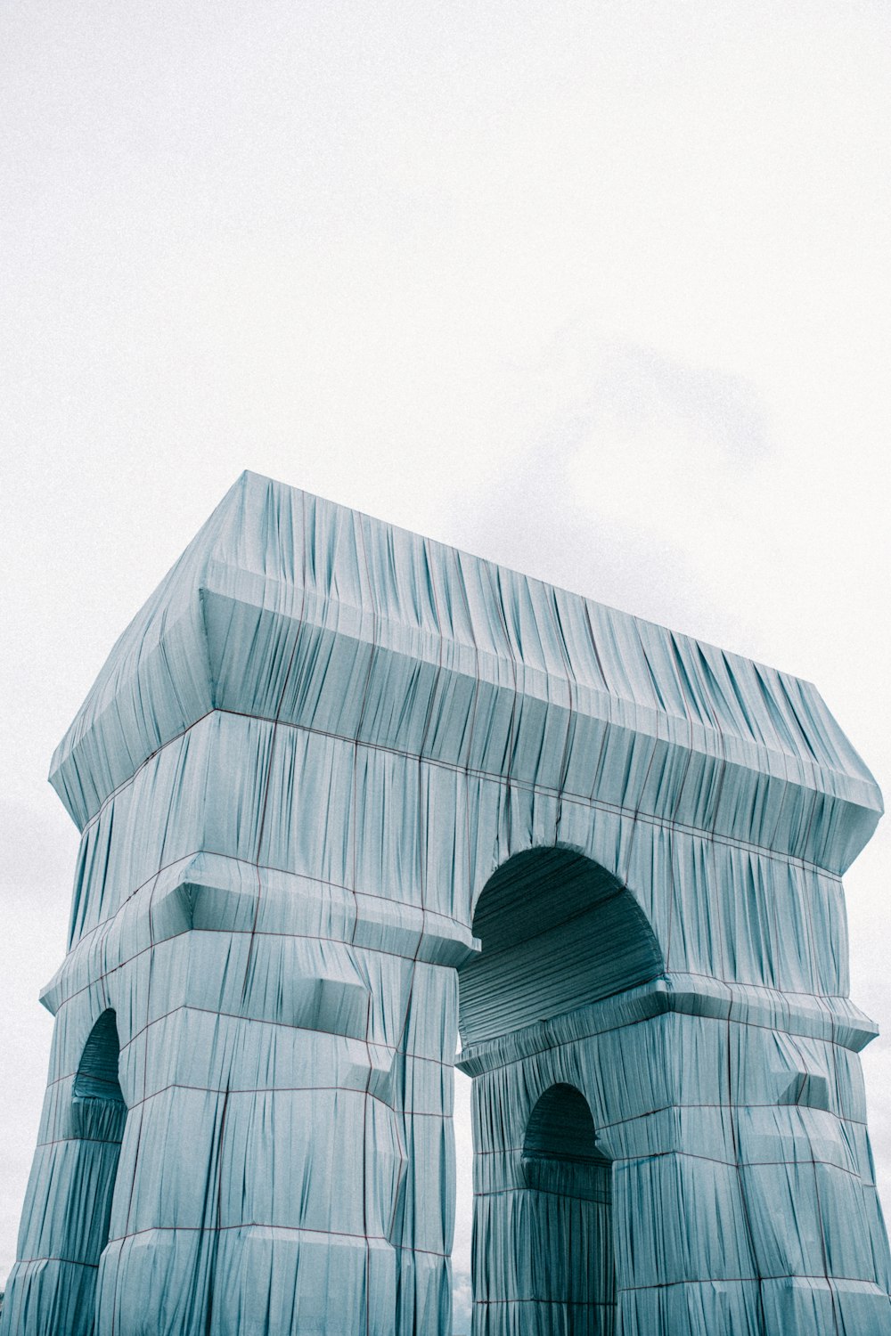 a building made out of ice on a cloudy day