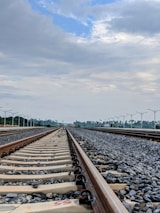 Railway tracks stretching into the horizon symbolizing engineering growth.