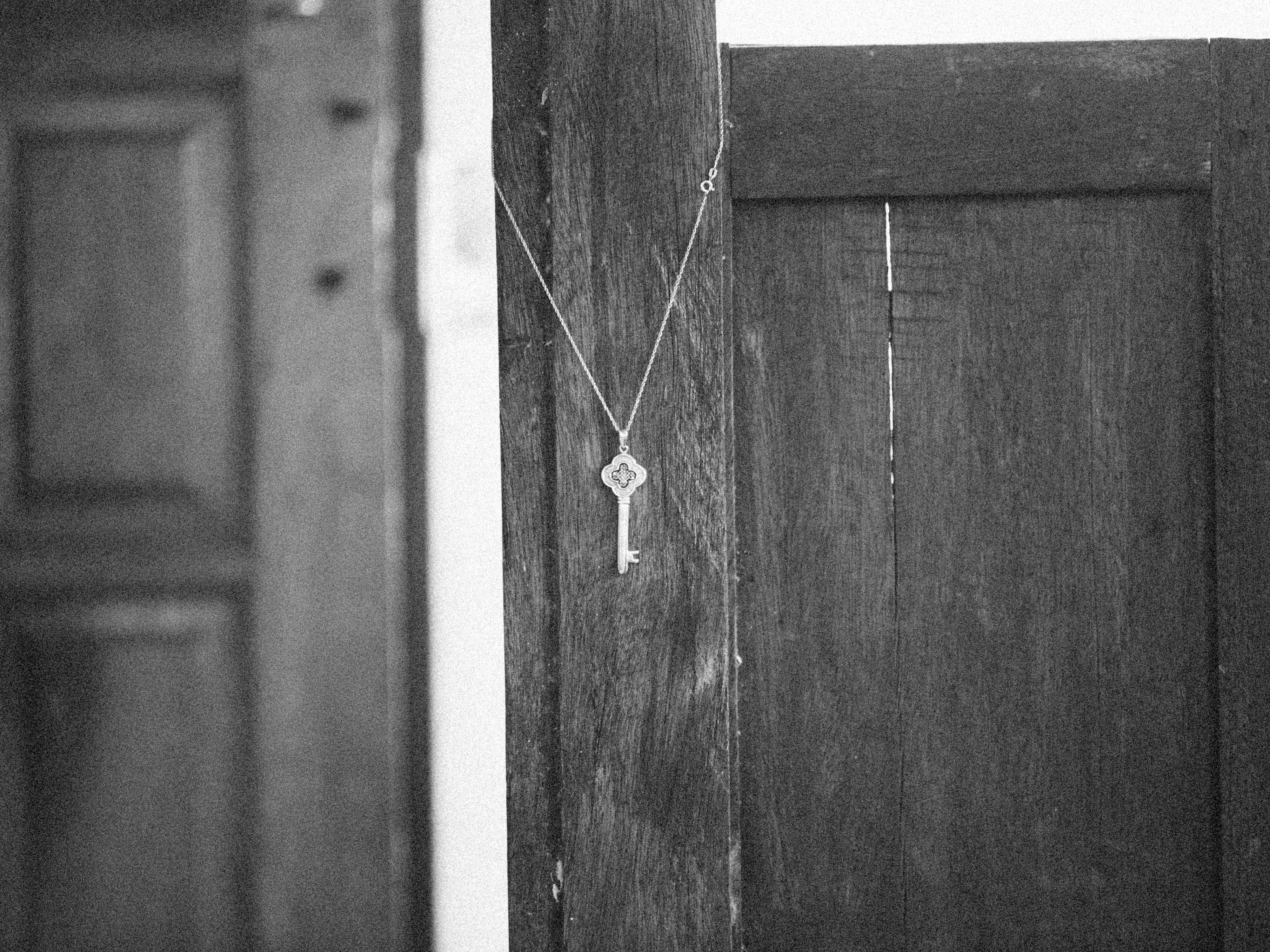 Key hanging on an old wooden door