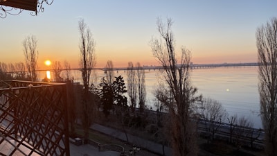 Sunrise view over the serene Ganga riverfront from hotel rr grand balcony.