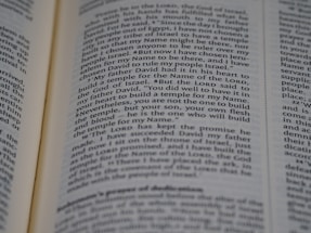 An open page of a book, likely a Bible, with text in English. The text includes a passage discussing historical religious figures and events.