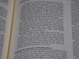 An open page of a book, likely a Bible, with text in English. The text includes a passage discussing historical religious figures and events.