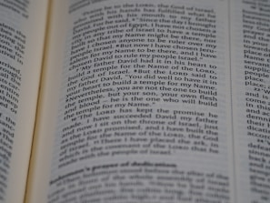 An open page of a book, likely a Bible, with text in English. The text includes a passage discussing historical religious figures and events.
