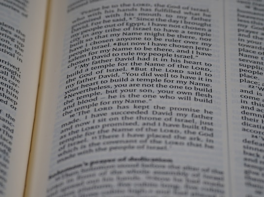 An open page of a book, likely a Bible, with text in English. The text includes a passage discussing historical religious figures and events.