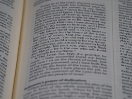 An open page of a book, likely a Bible, with text in English. The text includes a passage discussing historical religious figures and events.