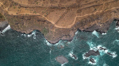 an aerial view of the ocean and land