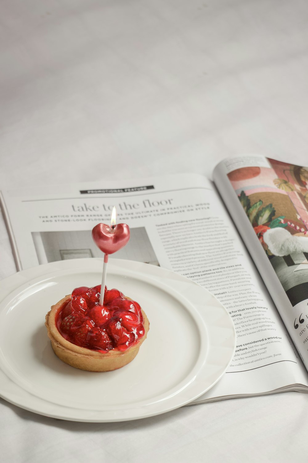 a pastry with a heart on top of it on a plate