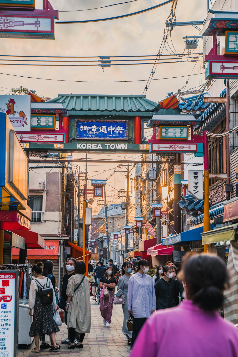 a group of people walking down a street