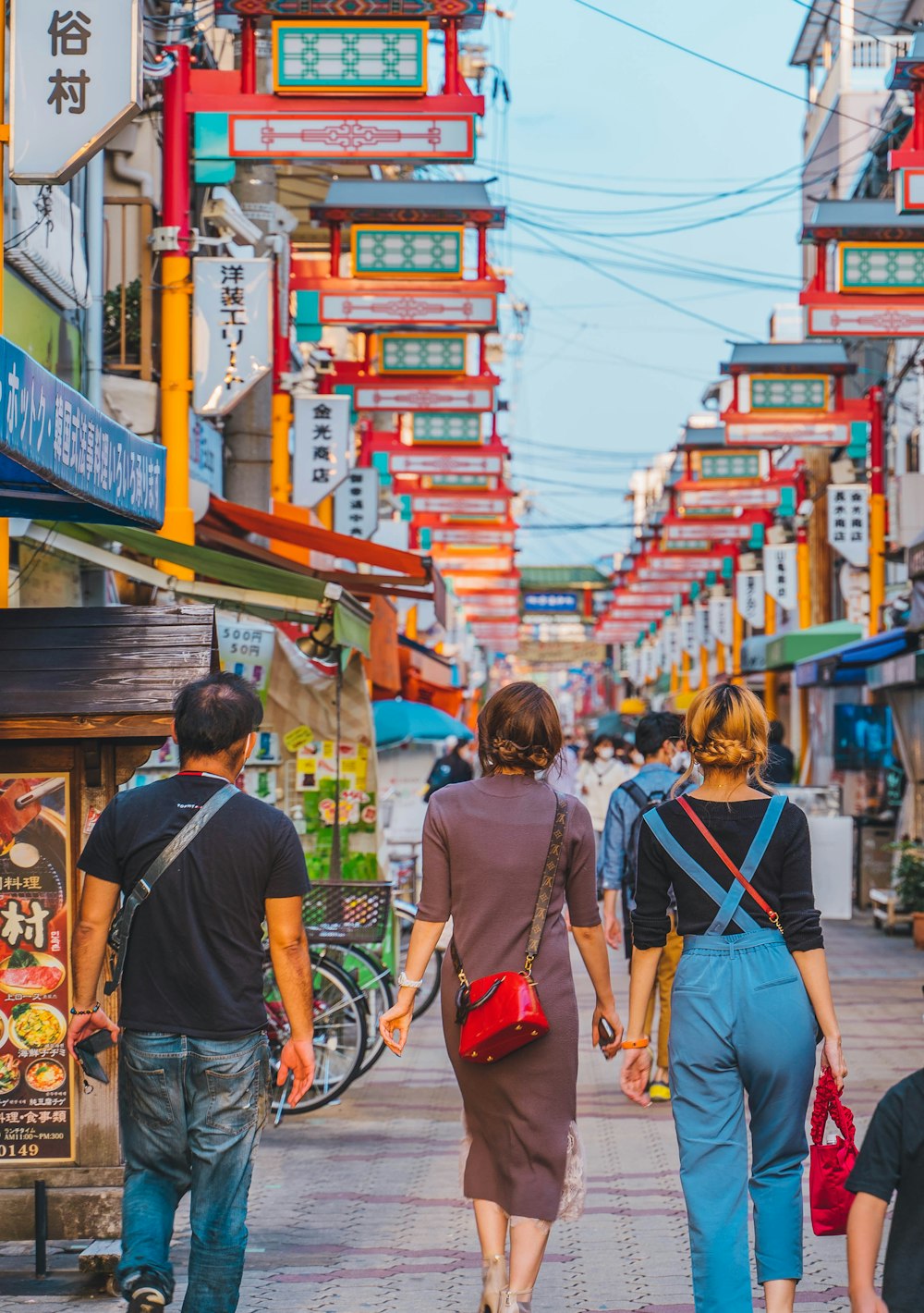 a group of people walking down a street