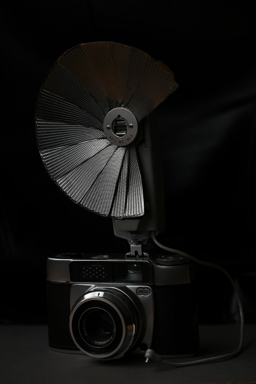 a camera with a fan on top of it