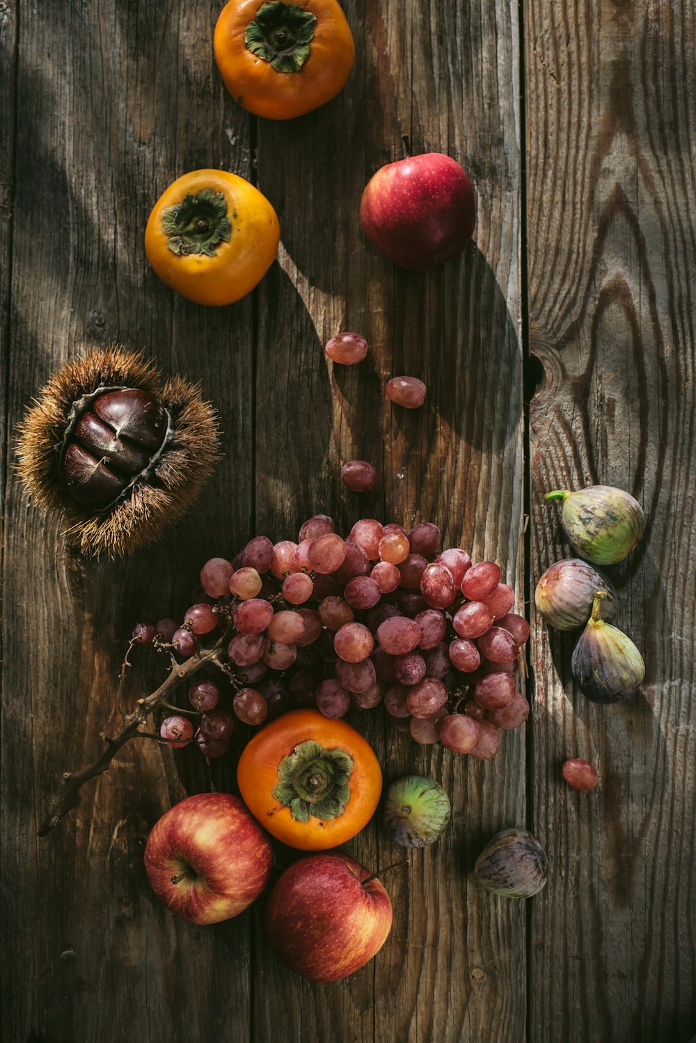 a bunch of fruit sitting on top of a wooden table