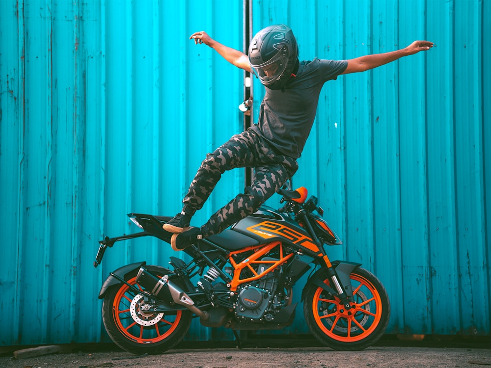 a man riding on the back of a motorcycle