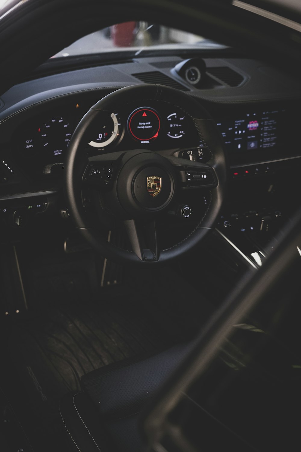 the interior of a car with a steering wheel and dashboard