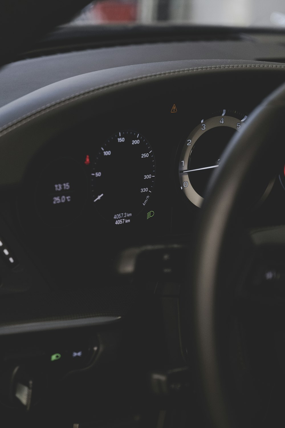 the dashboard of a car with a steering wheel