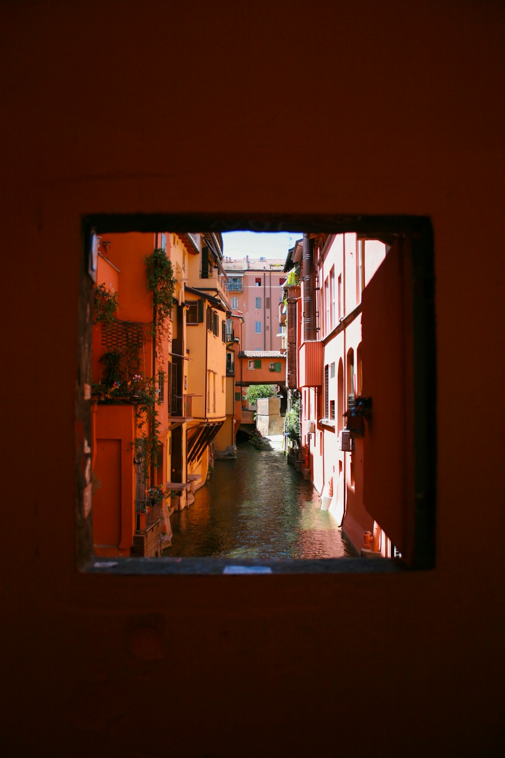 a view of a canal from a window in a building