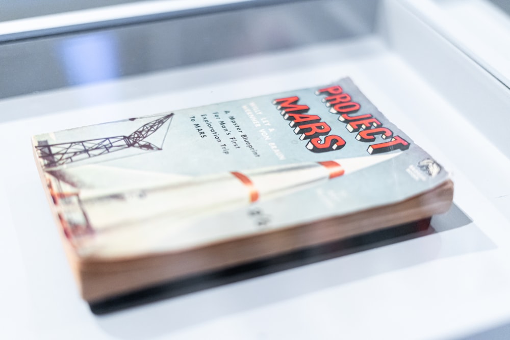 a book sitting on top of a white table