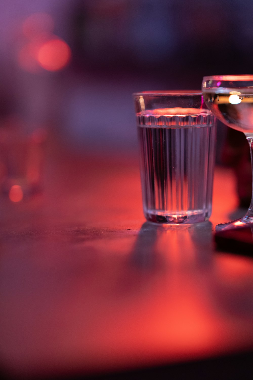 a close up of two glasses on a table