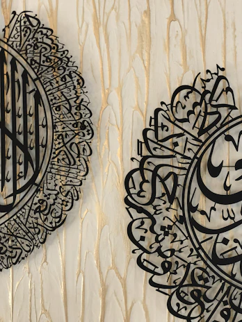 A serene white background with delicate black calligraphy symbols representing spirituality.