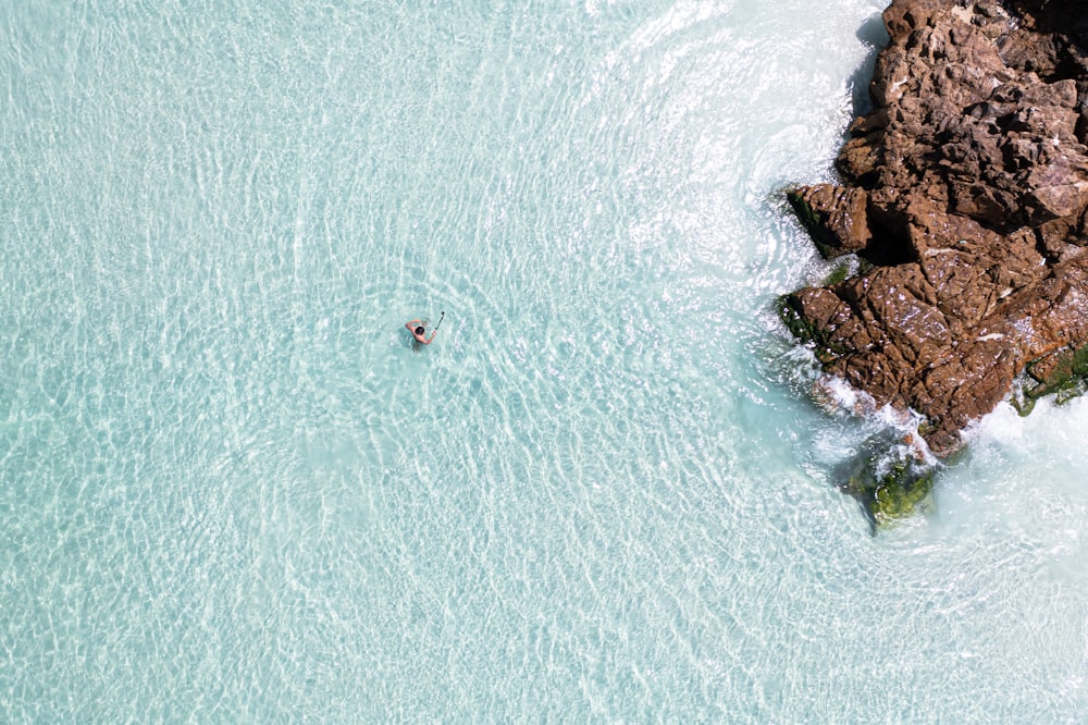 a person swimming in a body of water