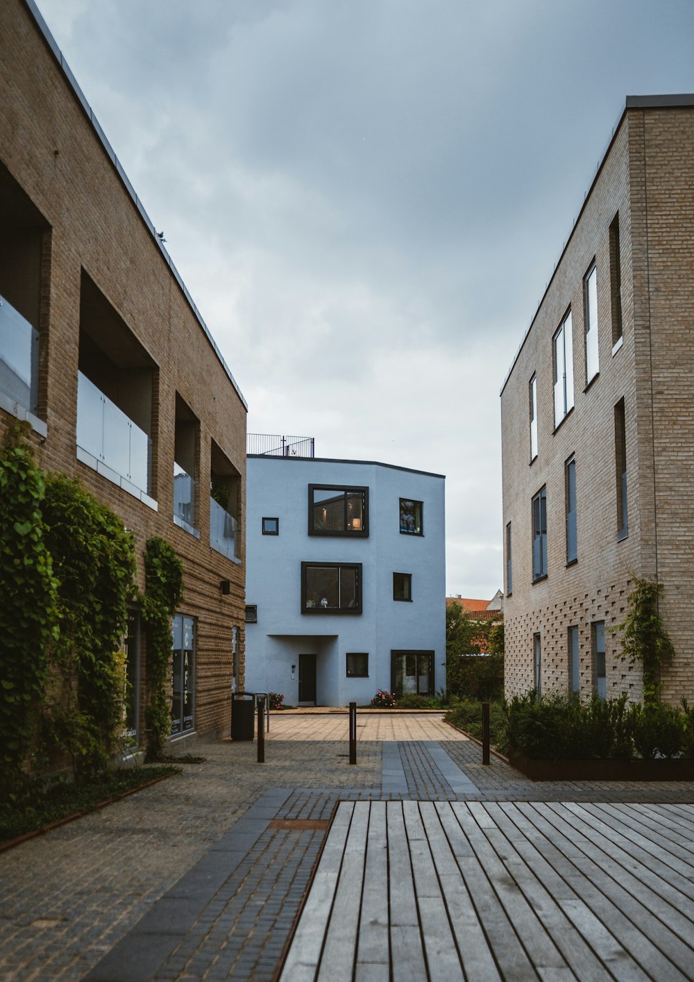 a building with a wooden walkway in front of it