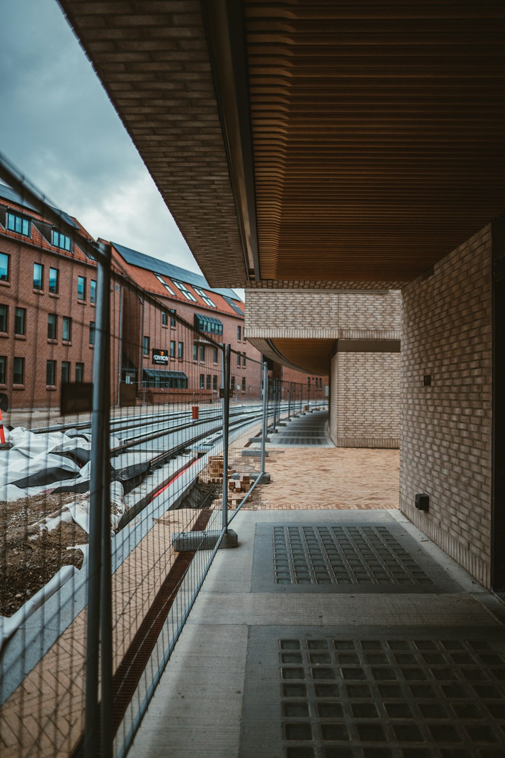 a view of a building through a fence