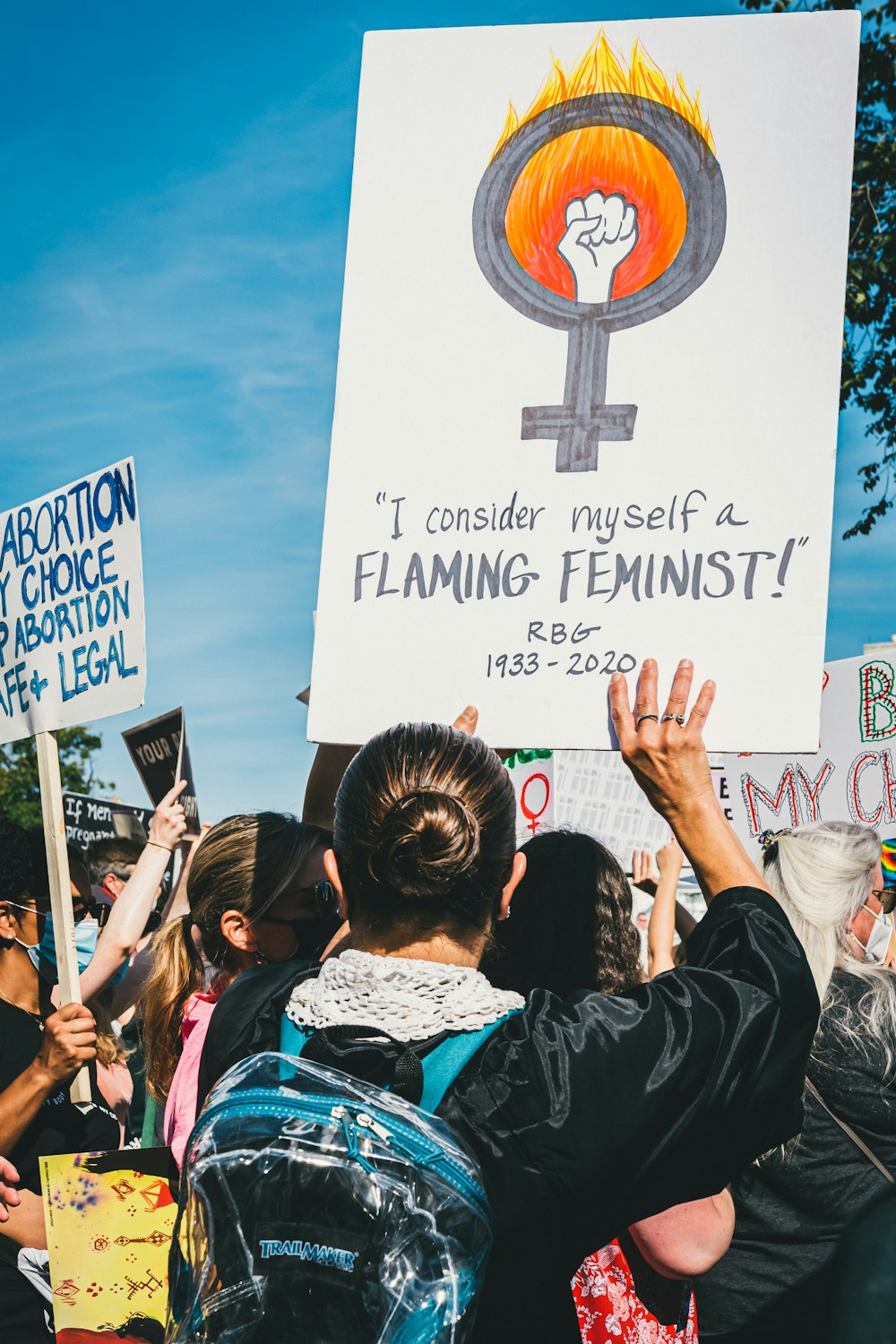 a group of people holding up signs in the air