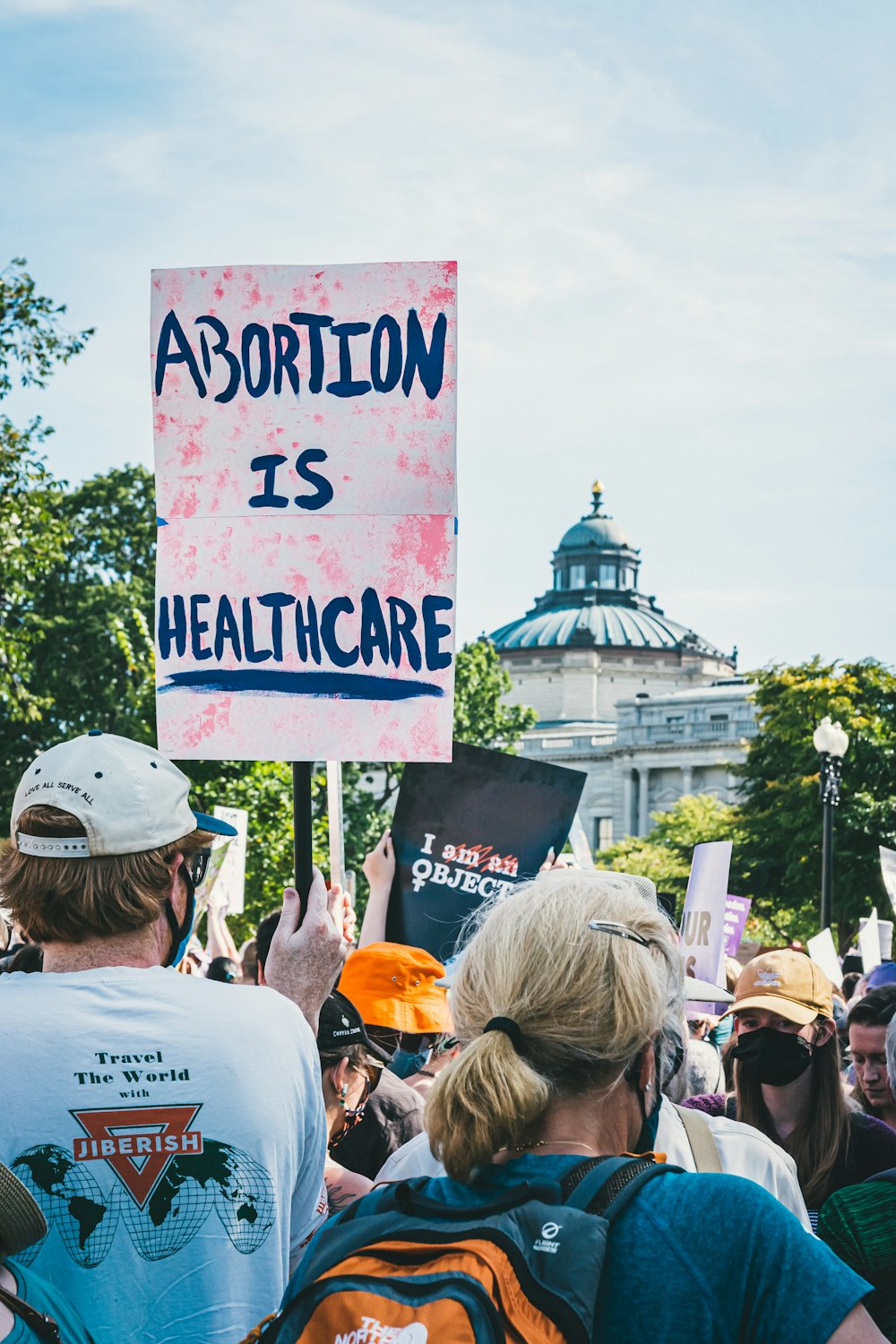 a group of people holding up a sign