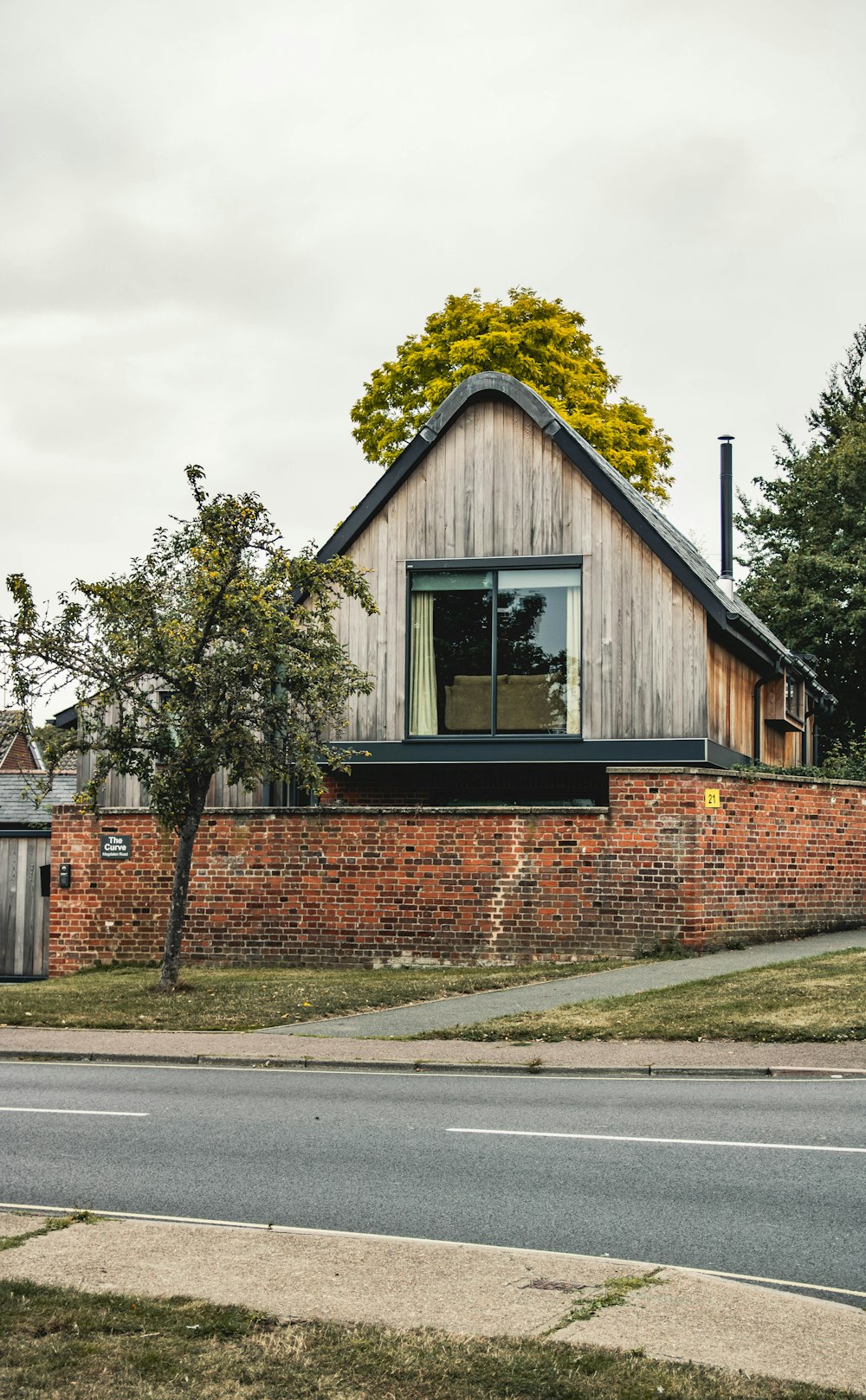 a house with a tree growing on the roof