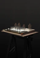 a model of a building with trees on top of it