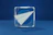 a paper airplane is in a glass box