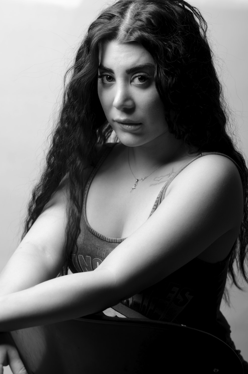 a black and white photo of a woman with long hair